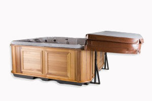 Folded brown cover resting on cabinet-free cover shelf behind cedar spa