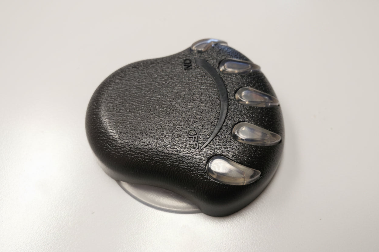Black bear-paw style air control knob with clear claws and ON OFF arrow, shown on white surface