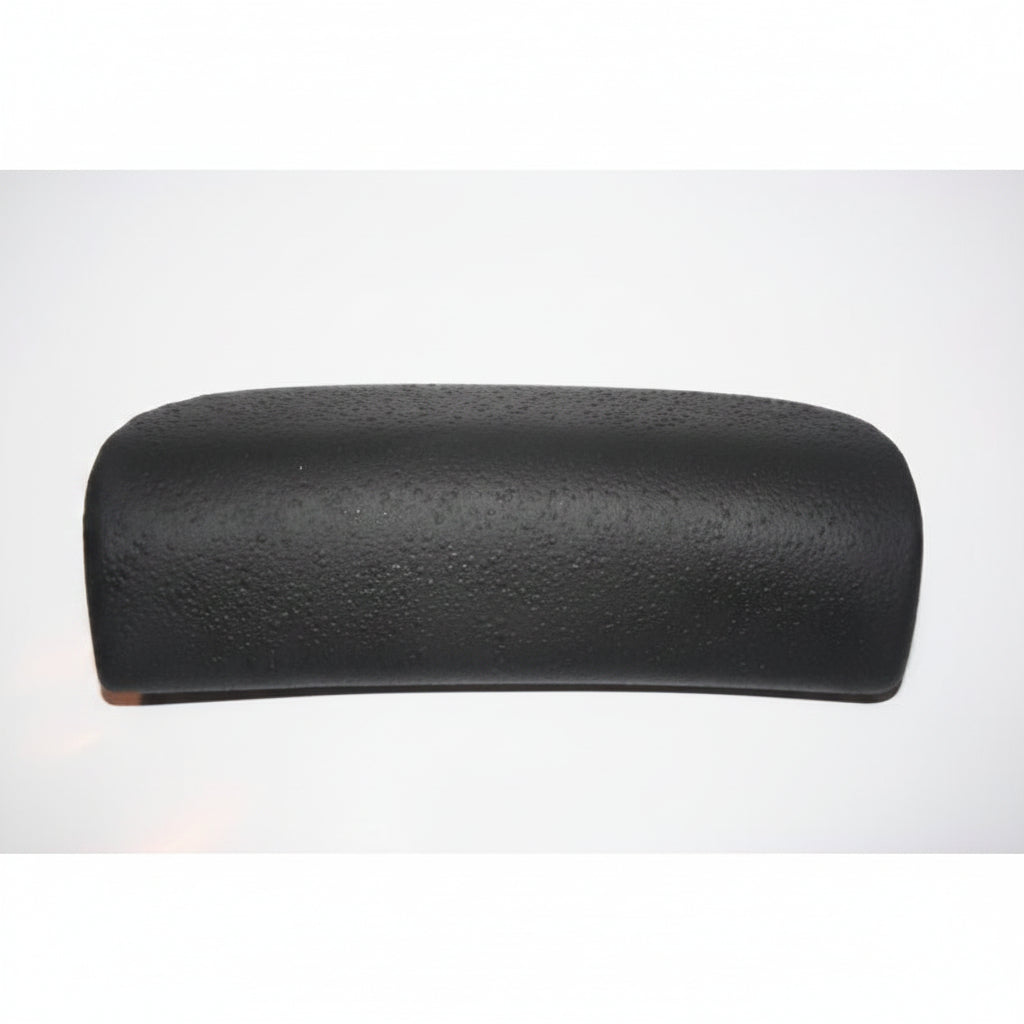 Black rectangular Coyote spa pillow with rounded corners and textured surface, angled view