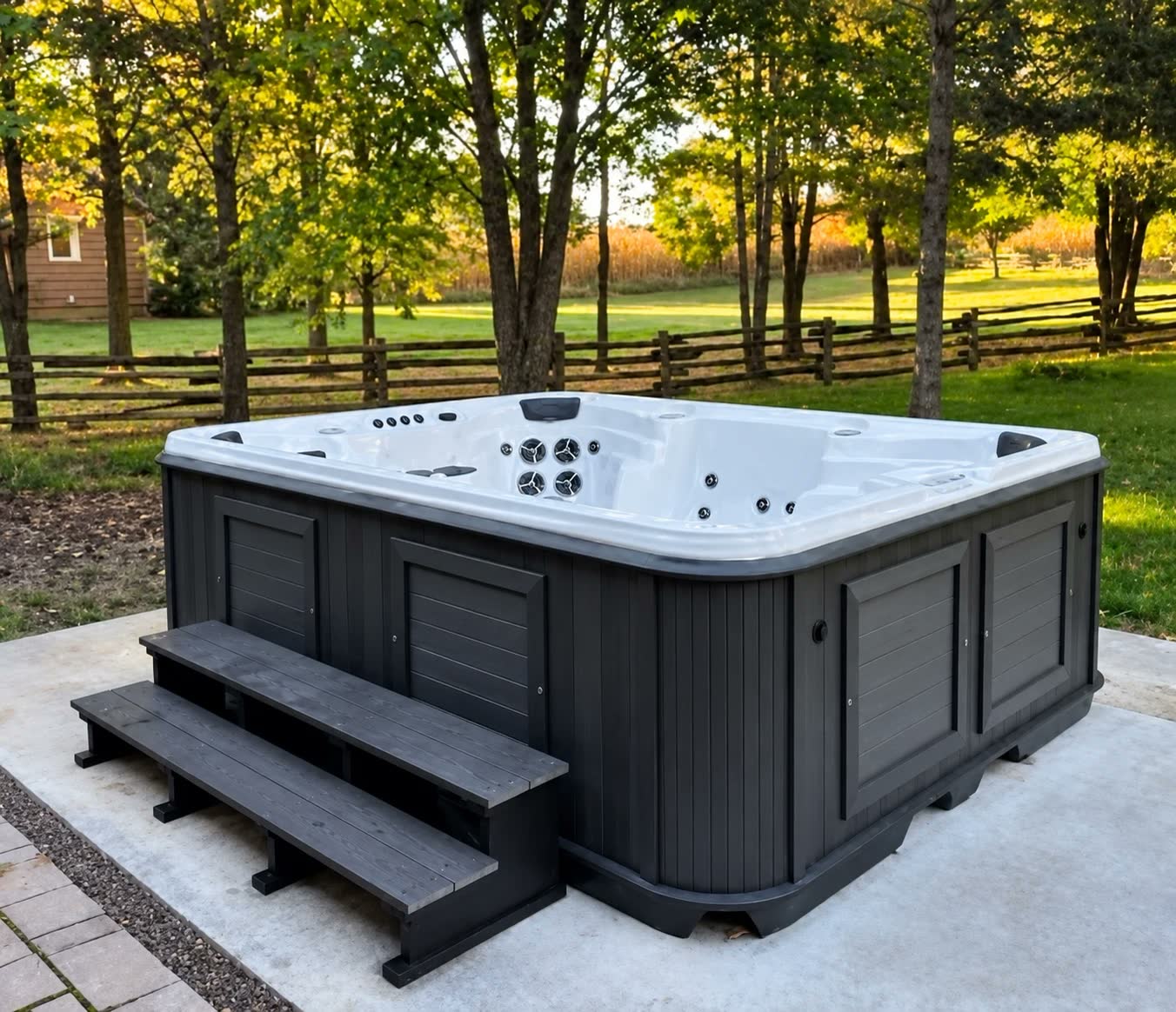 Arctic Spas hot tub with a dark cabinet and steps on a backyard patio